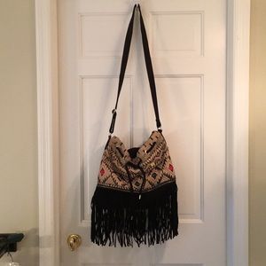 Urban Outfitters crossbody fringe bucket bag.